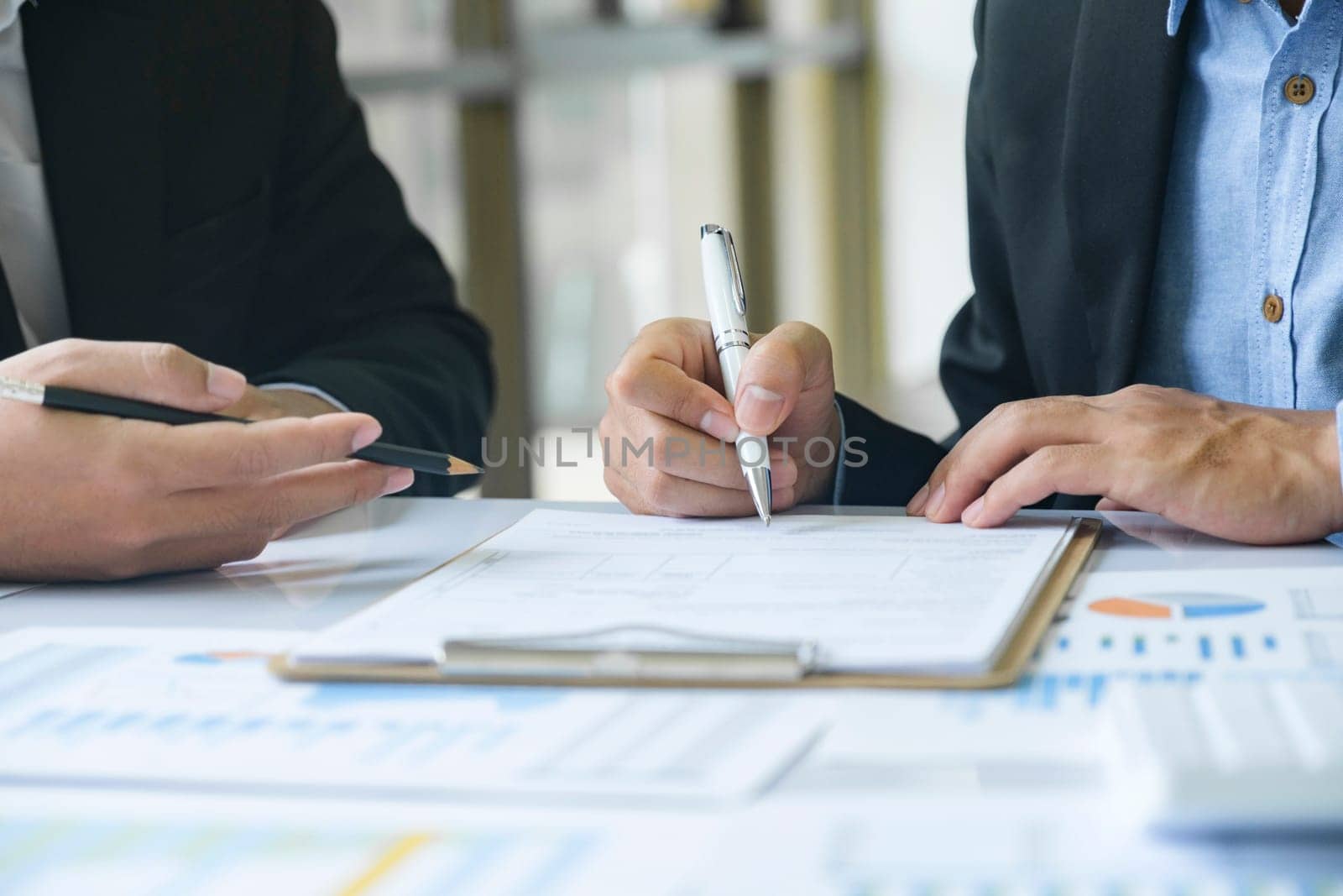 Business man sign a contract investment professional document agreement, ready signing profitable offer agreement after checking contract terms of conditions, executive manager involved in legal paperwork.