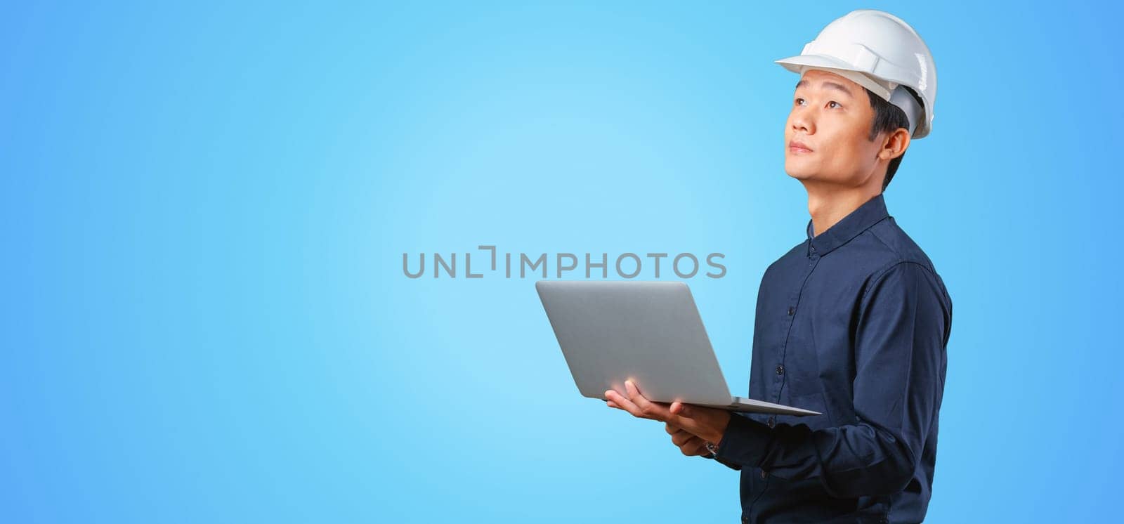 Man asian engineer with laptop by Fabrikasimf