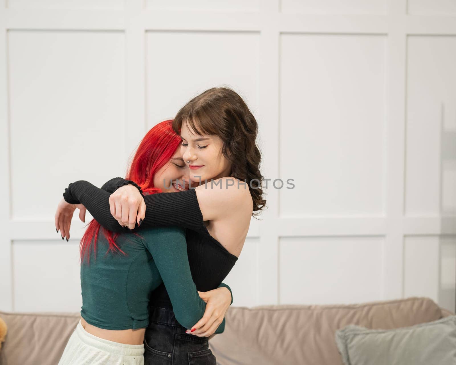 Portrait of two tenderly hugging women. Lesbian intimacy