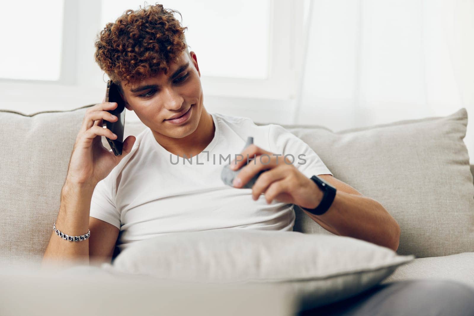 man interior freelancer using laptop curly sports selfies message mockup young sitting modern smile online