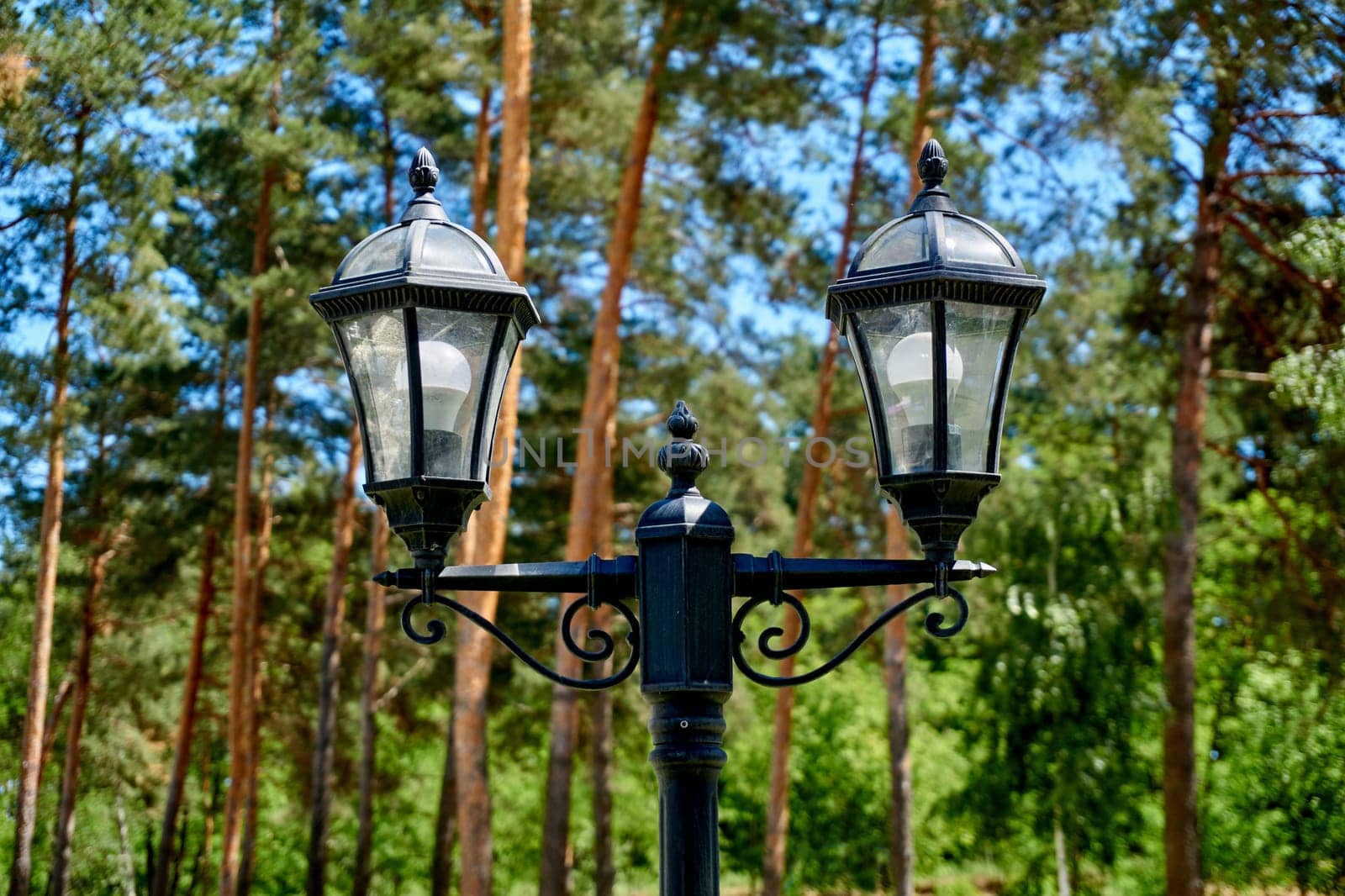 a tall pole with a light at the top, a street light