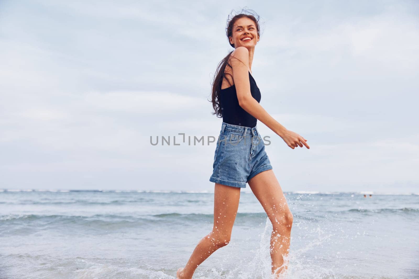 beach woman sunset sea copy ocean relax active space freedom running smile nature beautiful summer travel sexy beauty sunrise lifestyle young tan