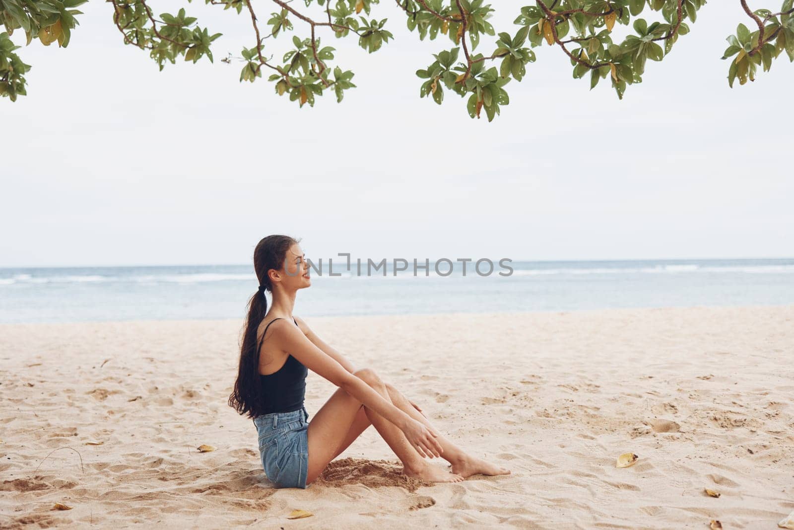 view woman vacation beach freedom sitting nature sea travel sand back smile by SHOTPRIME