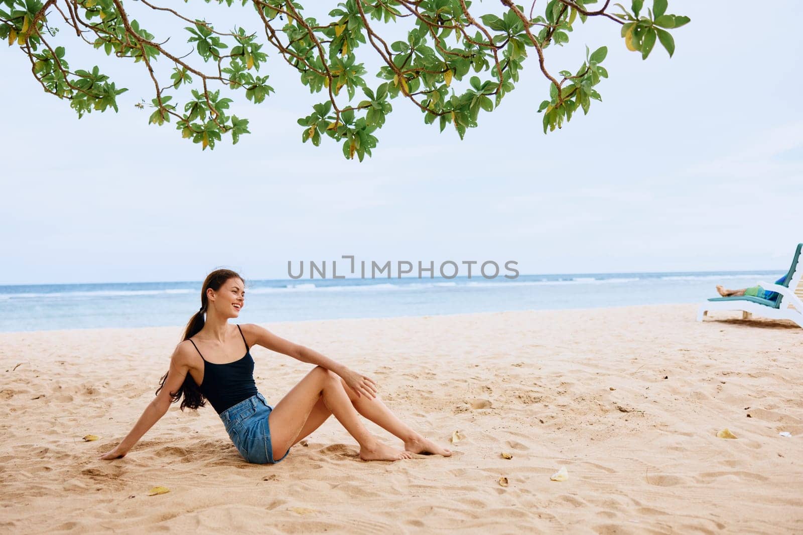 woman smile vacation freedom sea nature beach sitting travel holiday sand by SHOTPRIME