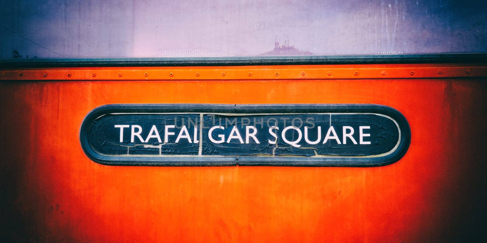 Trafalgar Square vintage sign on a London bus. Vintage camera filter added to image by DAndreev