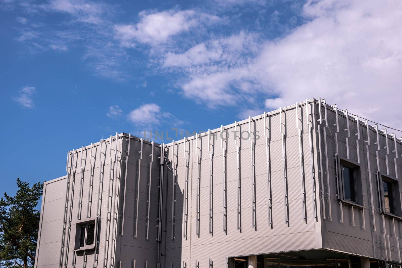 exterior walls of the building for cladding facades with decorative panels. crate on the facade of the building. Building house, installation of galvanized crate