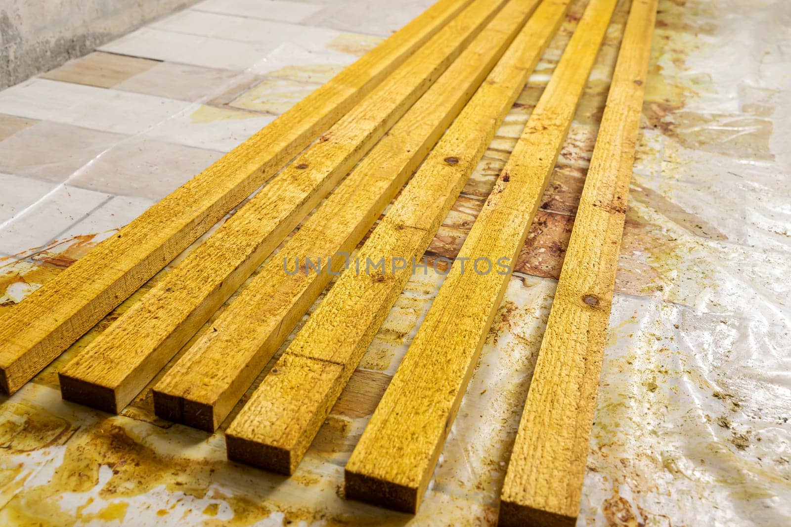 painted wooden slats dry on the floor in the workshop by audiznam2609