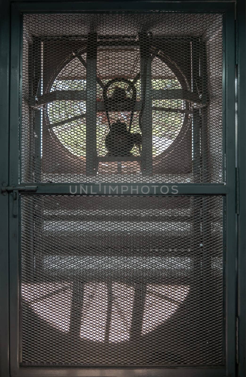 Big fan electric ventilation fan is located on the wall of the gym. Light and Shadow, Space for text, Selective Focus.