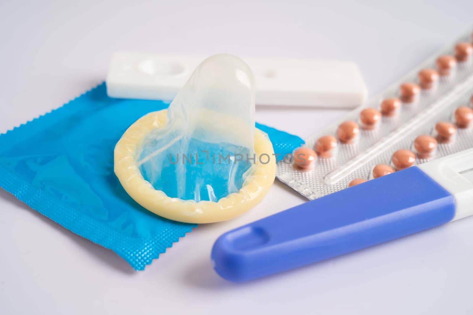 Birth control pills and condom, contraception health and medicine. by pamai