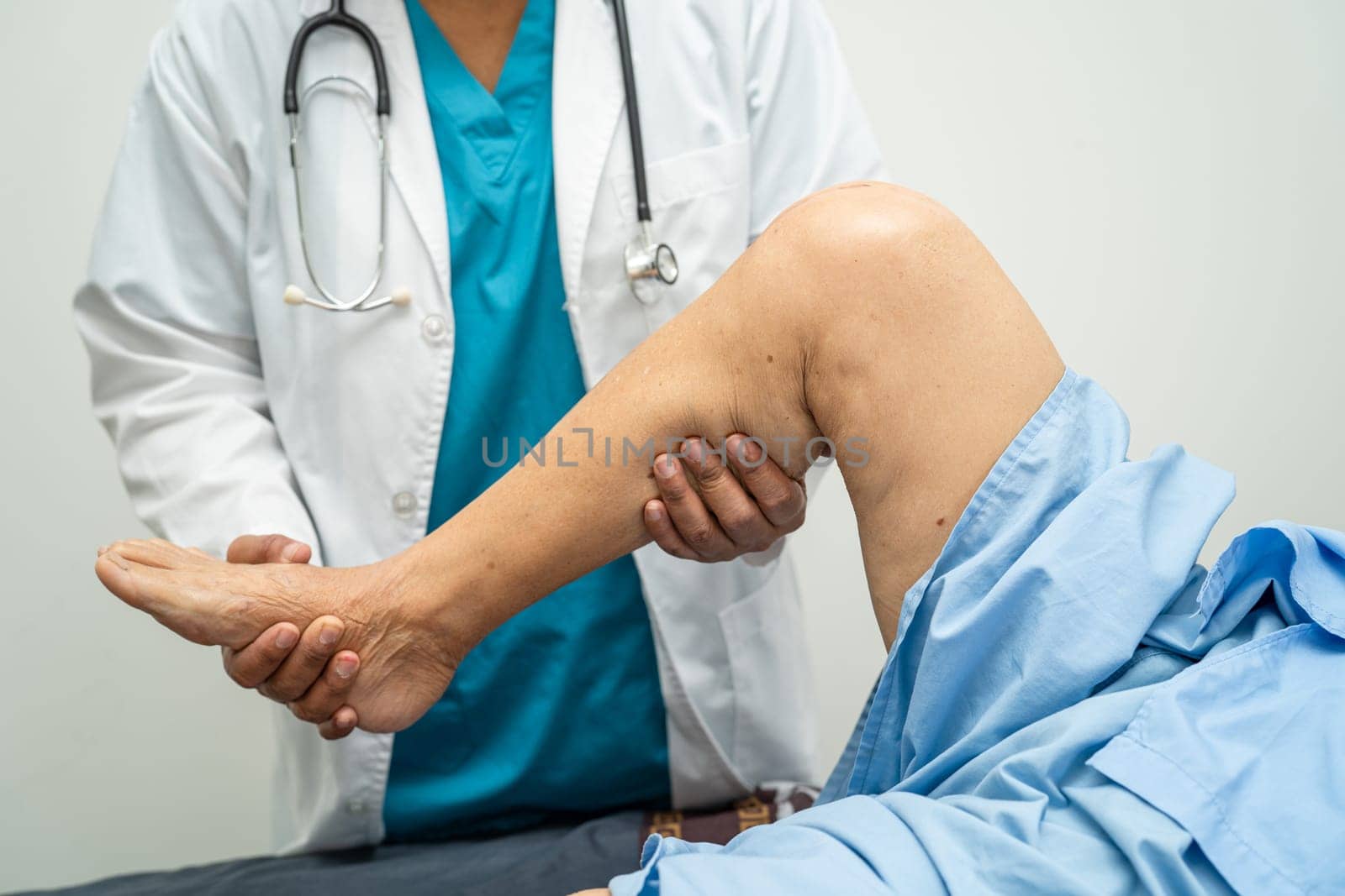 Asian elderly woman patient show her scars surgical total knee joint replacement Suture wound surgery arthroplasty on bed in hospital, healthy strong medical concept. by pamai