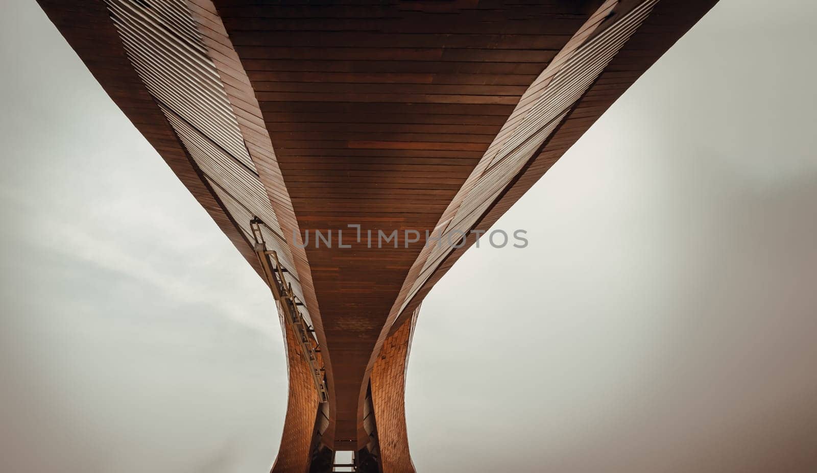 Nakhonsawan, Thailand - Apr 23, 2023 - Exterior Design Art Architecture Underneath the Bridge, named PA SAN or Pasan Wooden Bridge, The memorial building landmark architecture for the origin of Chao Phraya River at Pak Nam Pho Located at the cape of Yom Island The confluence of the Ping and Nan rivers. Selective focus.
