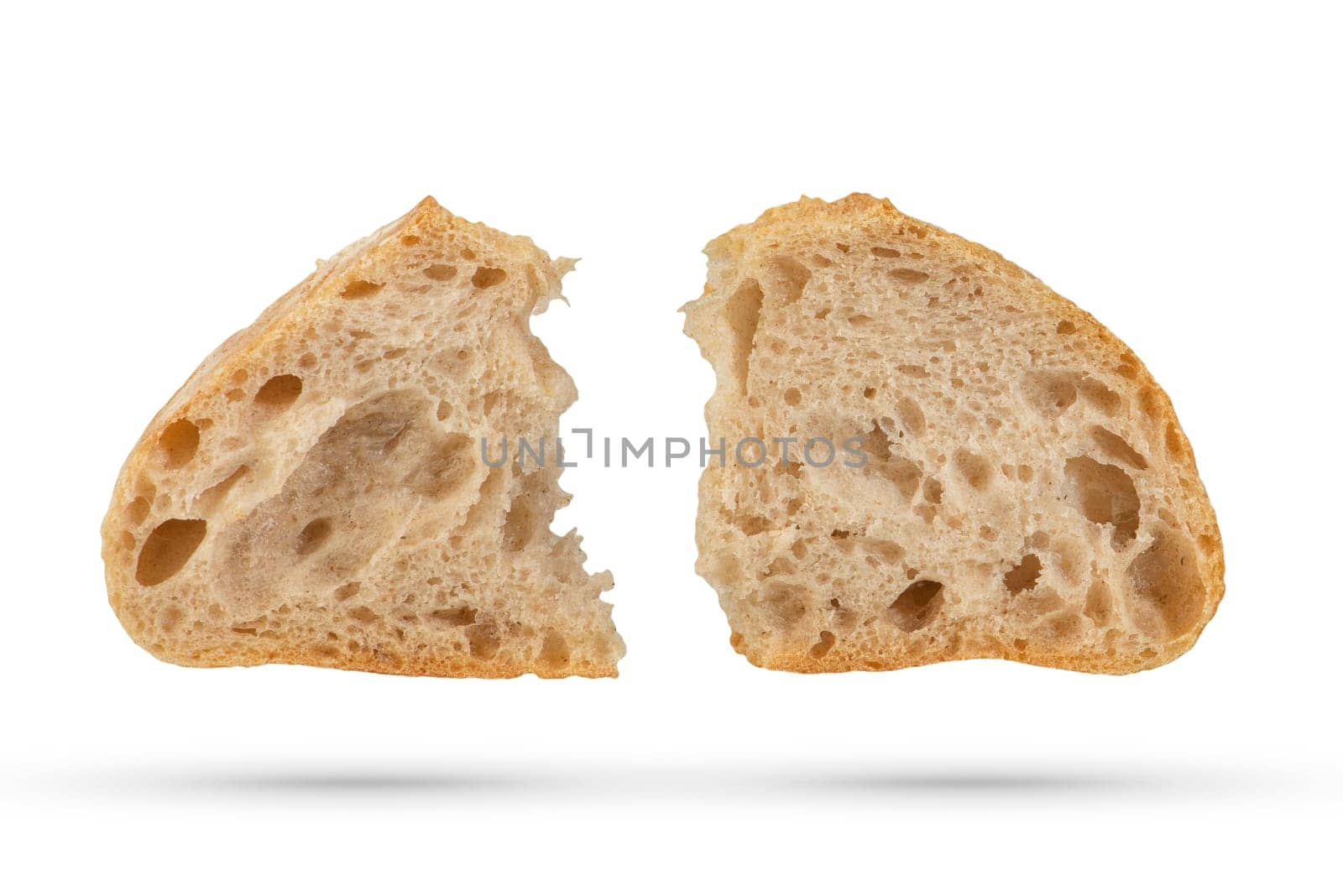 Two slices of fresh Ciabatta bread on a white isolated background. Slices hang or fall on a white background. The concept of Italian bread baking or delicious breakfast. by SERSOL