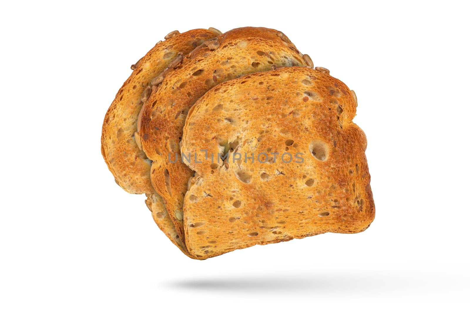 Isolate of three slices of toasted bread, for design or project. Toasted, golden, whole grain bread from a toaster, isolated on a white background. The concept of diet food or light breakfast