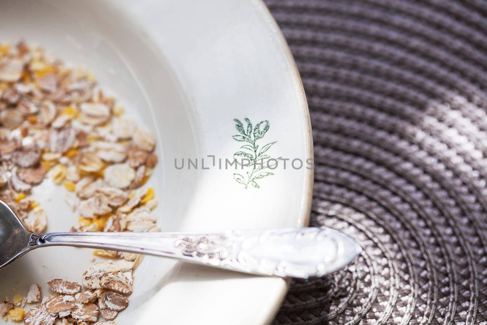 Oatmeal in bowl with nuts, useful food.