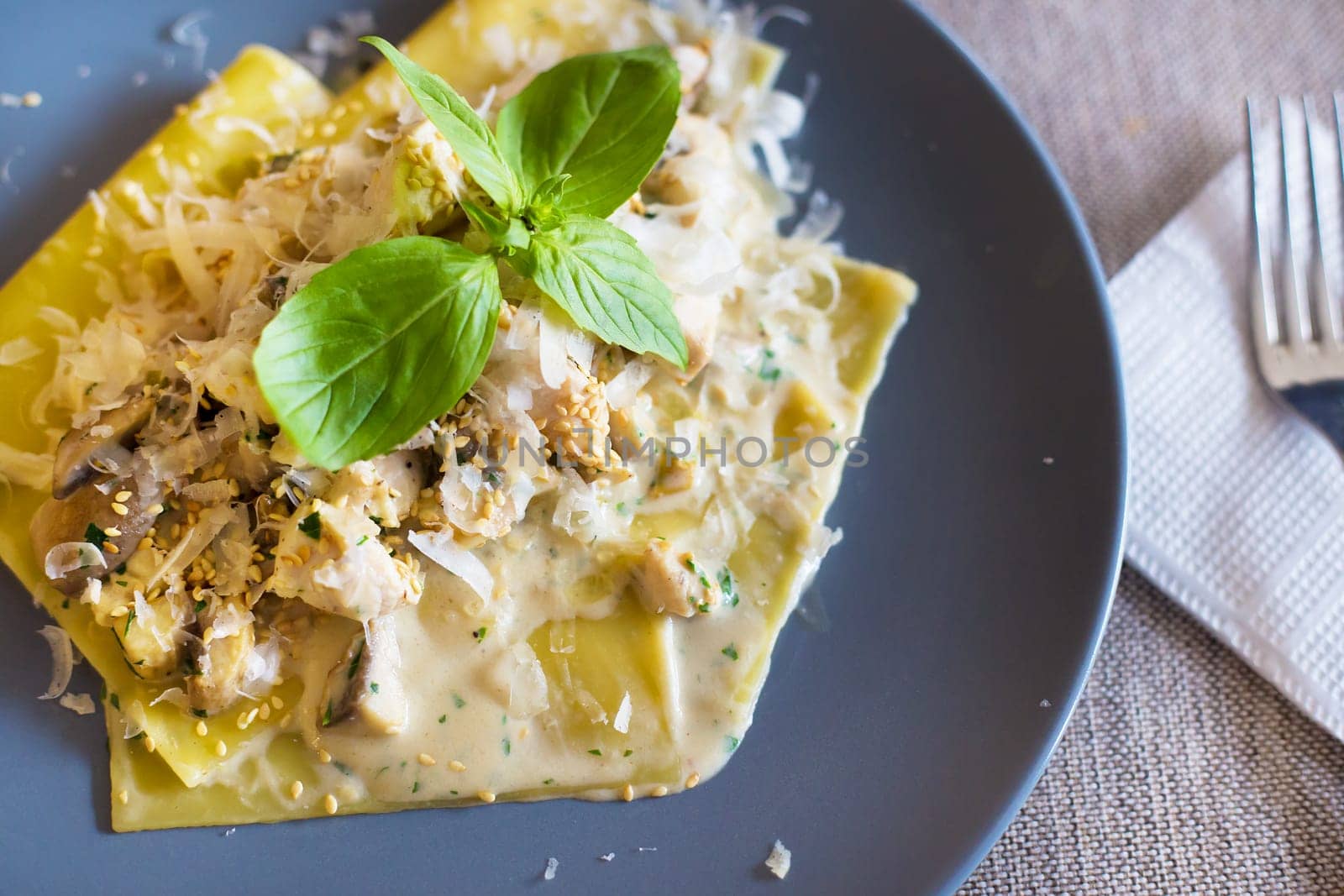 delicious macaroni pasta on a plate in a restaurant.