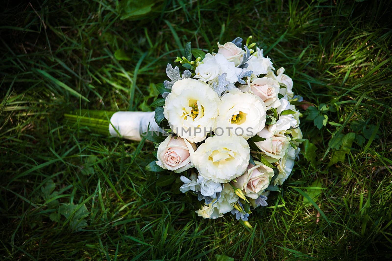 beautiful wedding flowers bouquet on the green grass