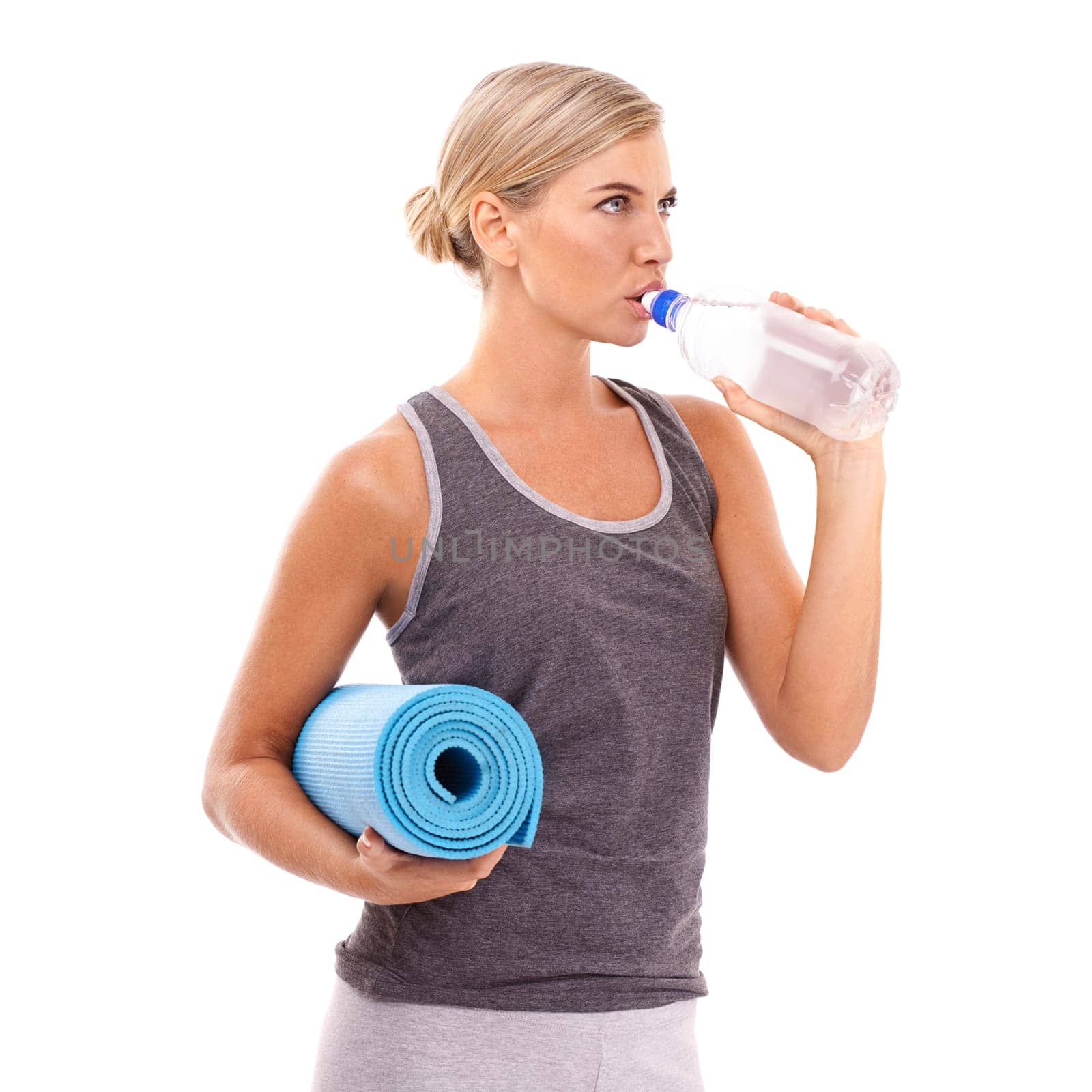Yoga, exercise mat and woman drinking water for body care hydration, fitness lifestyle or pilates studio workout. Healthcare wellness, training and health girl with liquid bottle on white background.