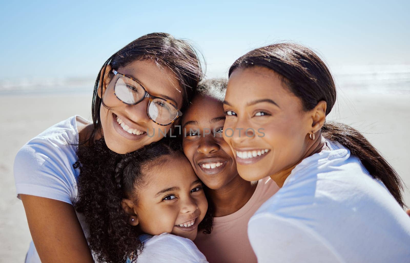 Black family, summer and kids portrait at ocean with mom enjoying USA vacation in sunshine. Love, care and happy family hug together with joyful smile on holiday break at sunny beach. by YuriArcurs