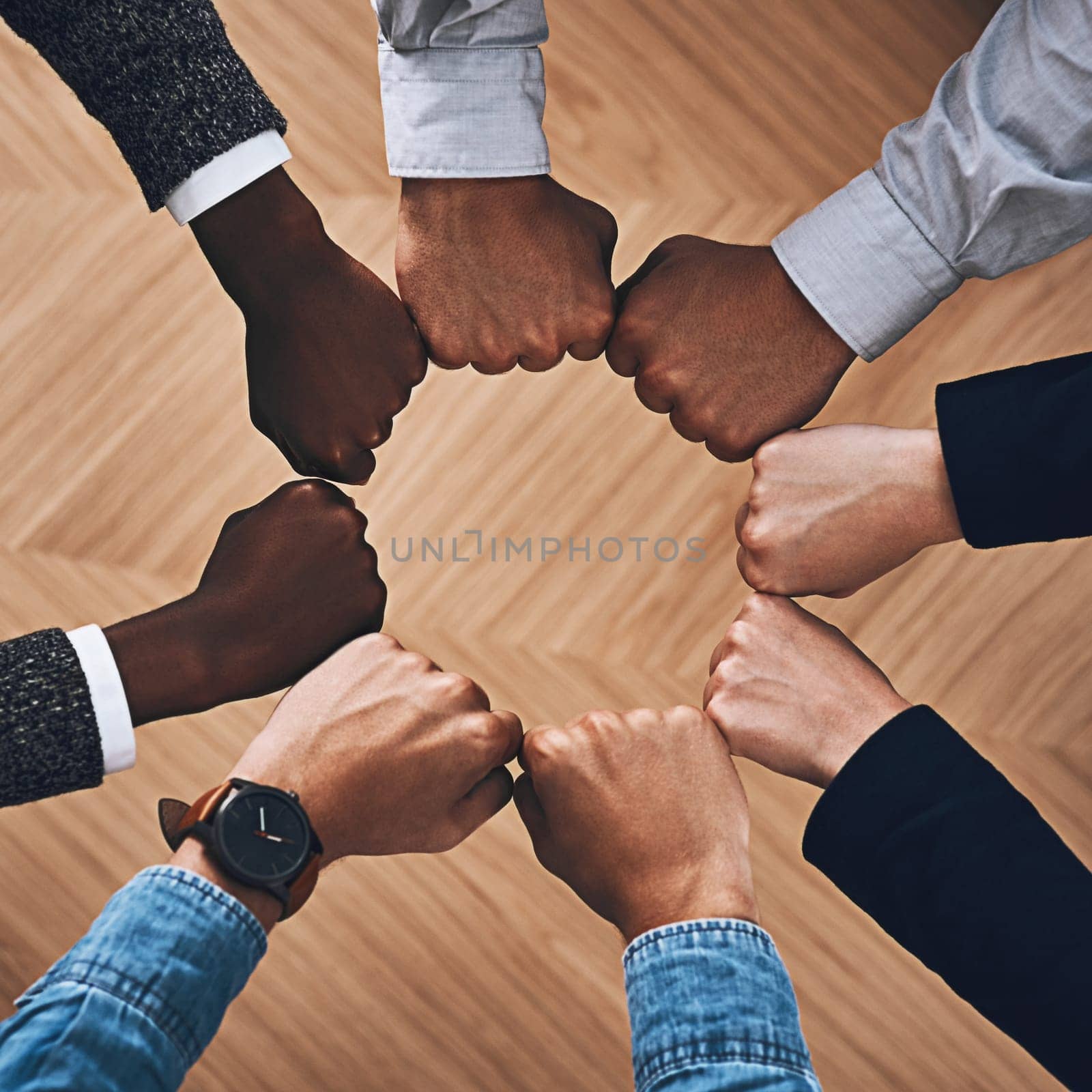 Team building, fist bump or hands of business people for motivation, group support or community in office. Teamwork, above or circle of fists for diversity, collaboration or partnership for a mission.
