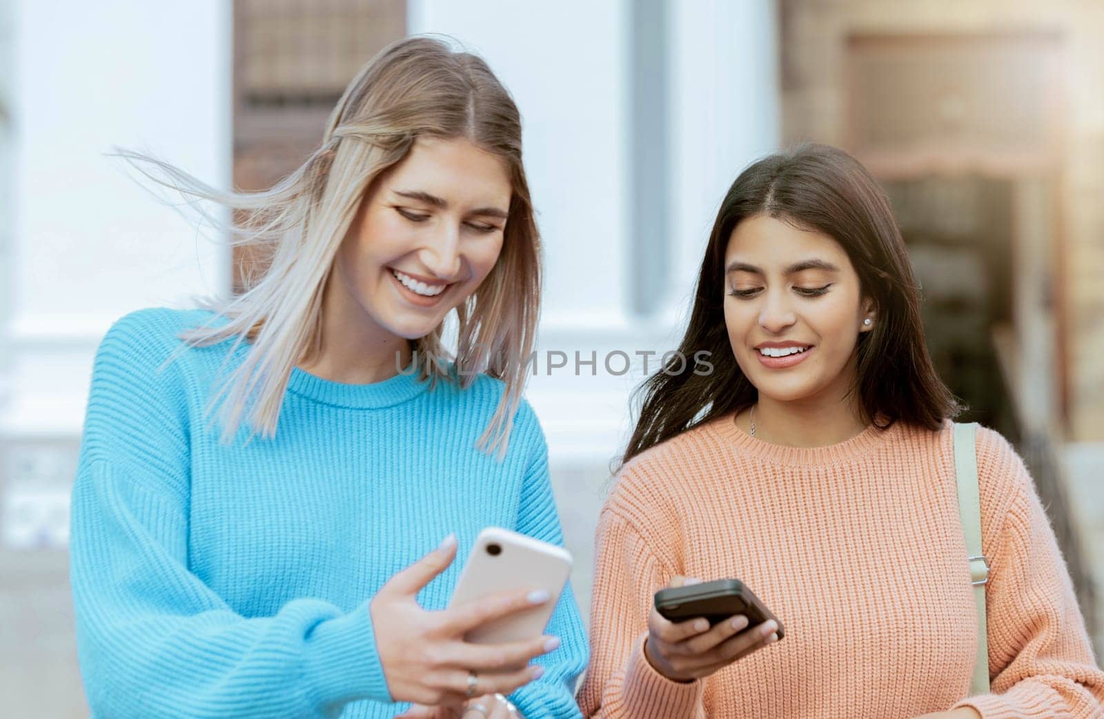 Friends, women with smartphone, social media and technology with students on campus, online and outdoor. Connection, meme or post with happiness, communication with 5g network and Gen z youth by YuriArcurs