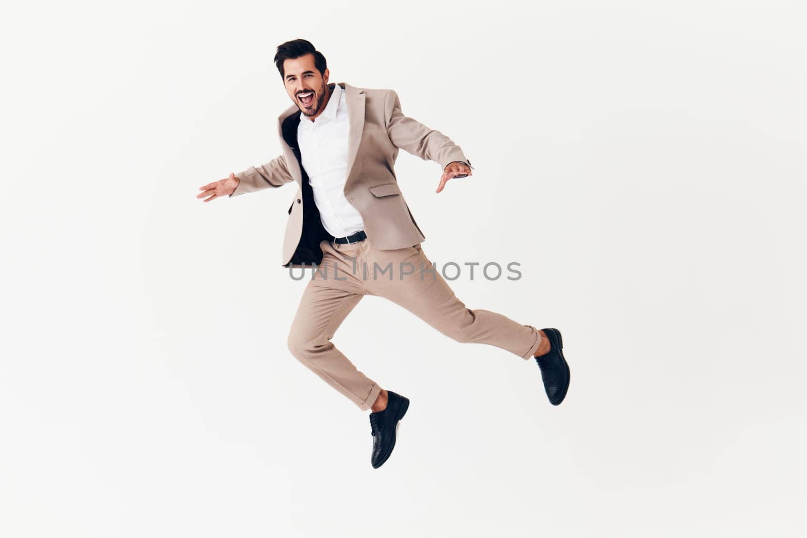 smiling man up running suit eyeglass businessman beige studio model confident victory adult young male work sexy winner job happy business