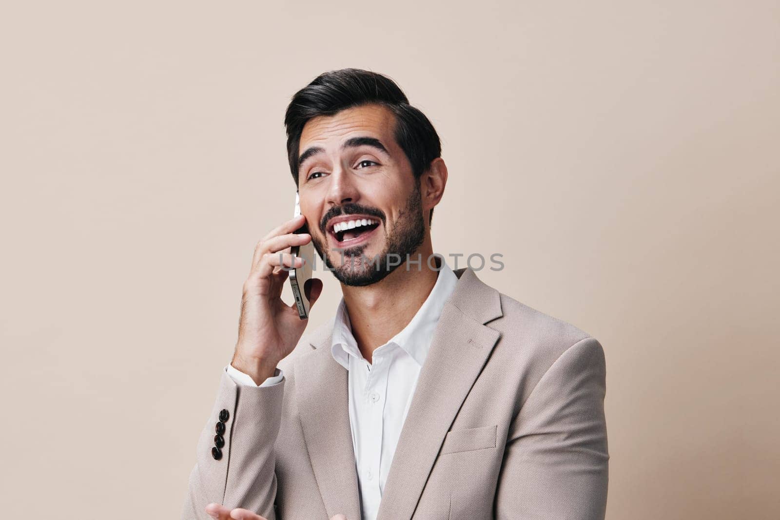 application man businessman hold success guy studio young handsome business phone portrait suit smile white happy phone smartphone call cyberspace mobile mobile