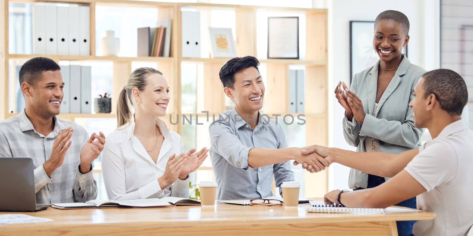 Handshake, applause and congratulations, recruitment success at startup meeting. Hand shake, thank you and a corporate welcome to new recruit or partner for business deal, achievement or agreement.