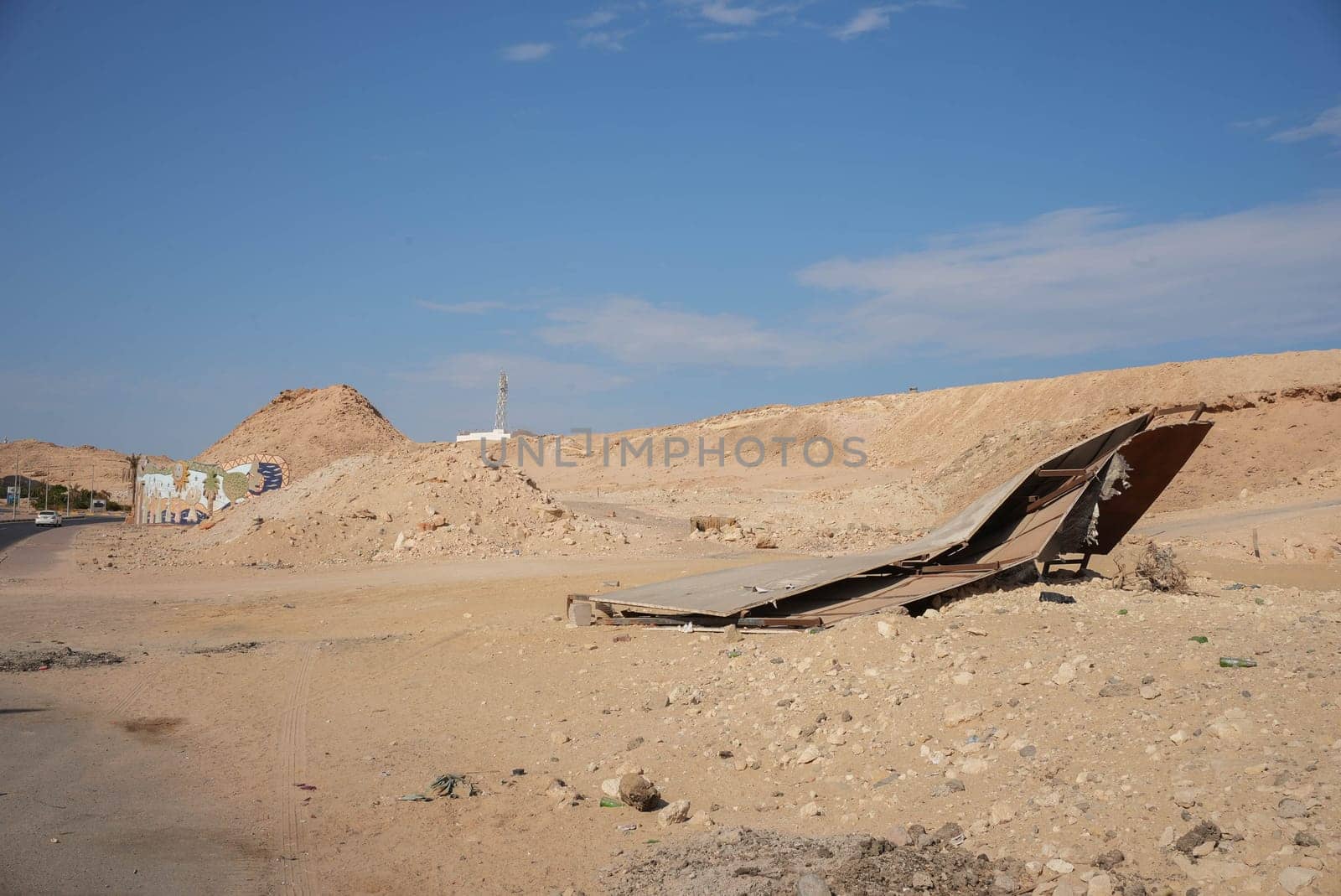 Desert with a fallen down sign board. High quality photo