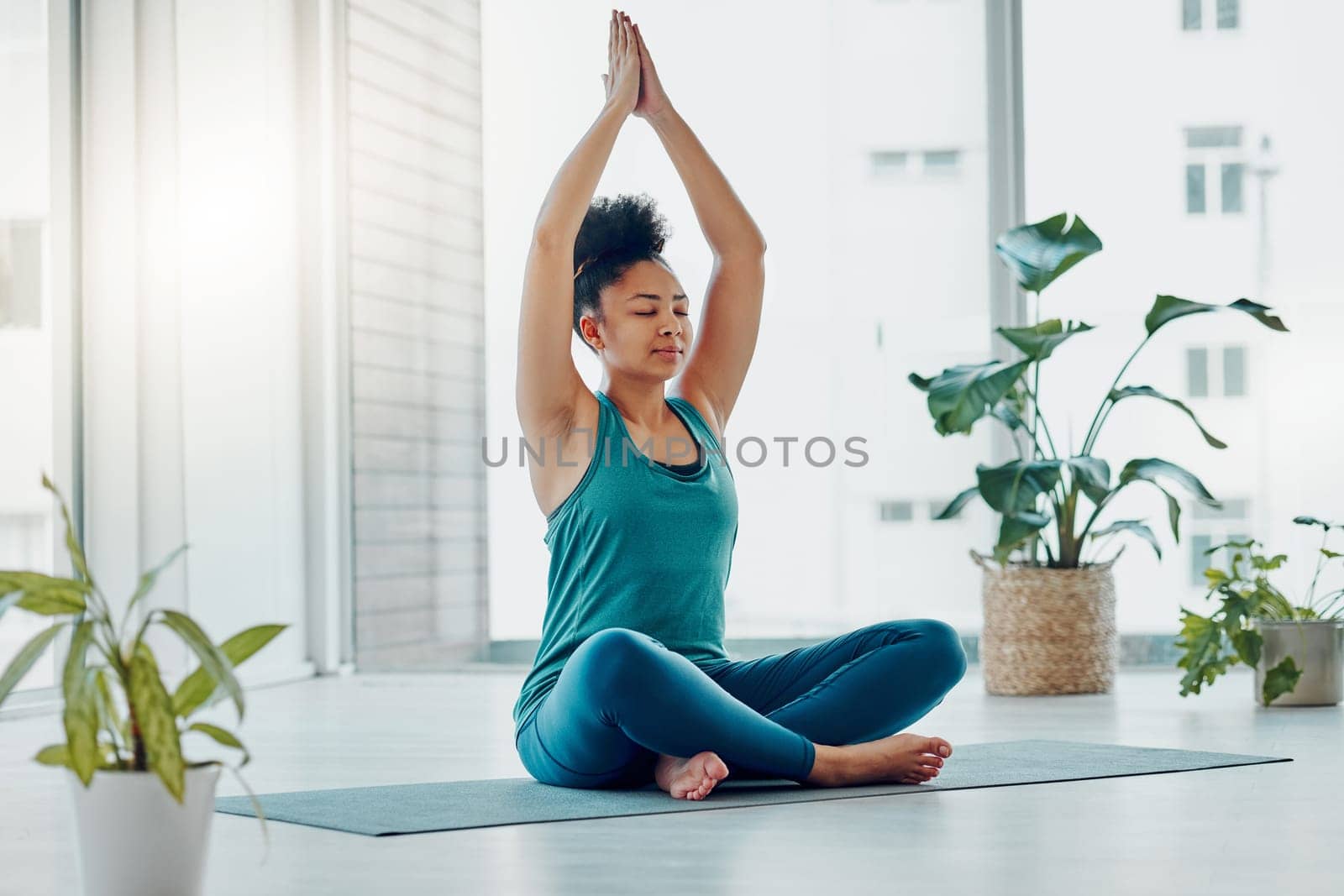 Yoga, meditation exercise and black woman prayer hands for fitness, peace and wellness. Young person in health studio for holistic workout, mental health and body balance with zen mind and energy.