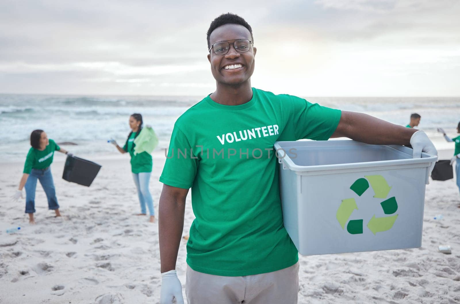 Cleaning, recycle and portrait of black man at beach for plastic, environment or earth day. Recycling, sustainability and climate change with volunteer and trash for pollution and eco friendly.