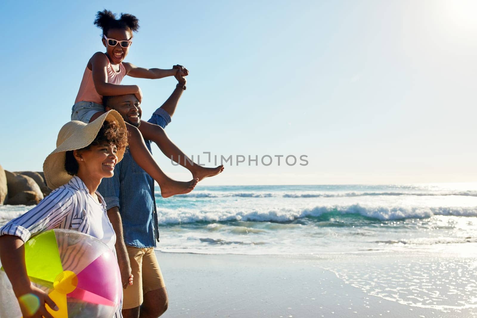 Walking, beach and profile of relax black family travel, happy and enjoy outdoor quality time together. Ocean sea water, blue sky mockup or freedom for bonding people on Jamaica holiday in summer.