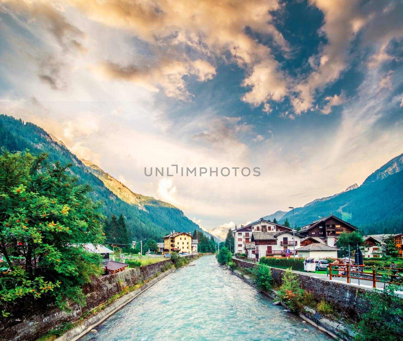Wonderful scenery of river in alpine town at sunset