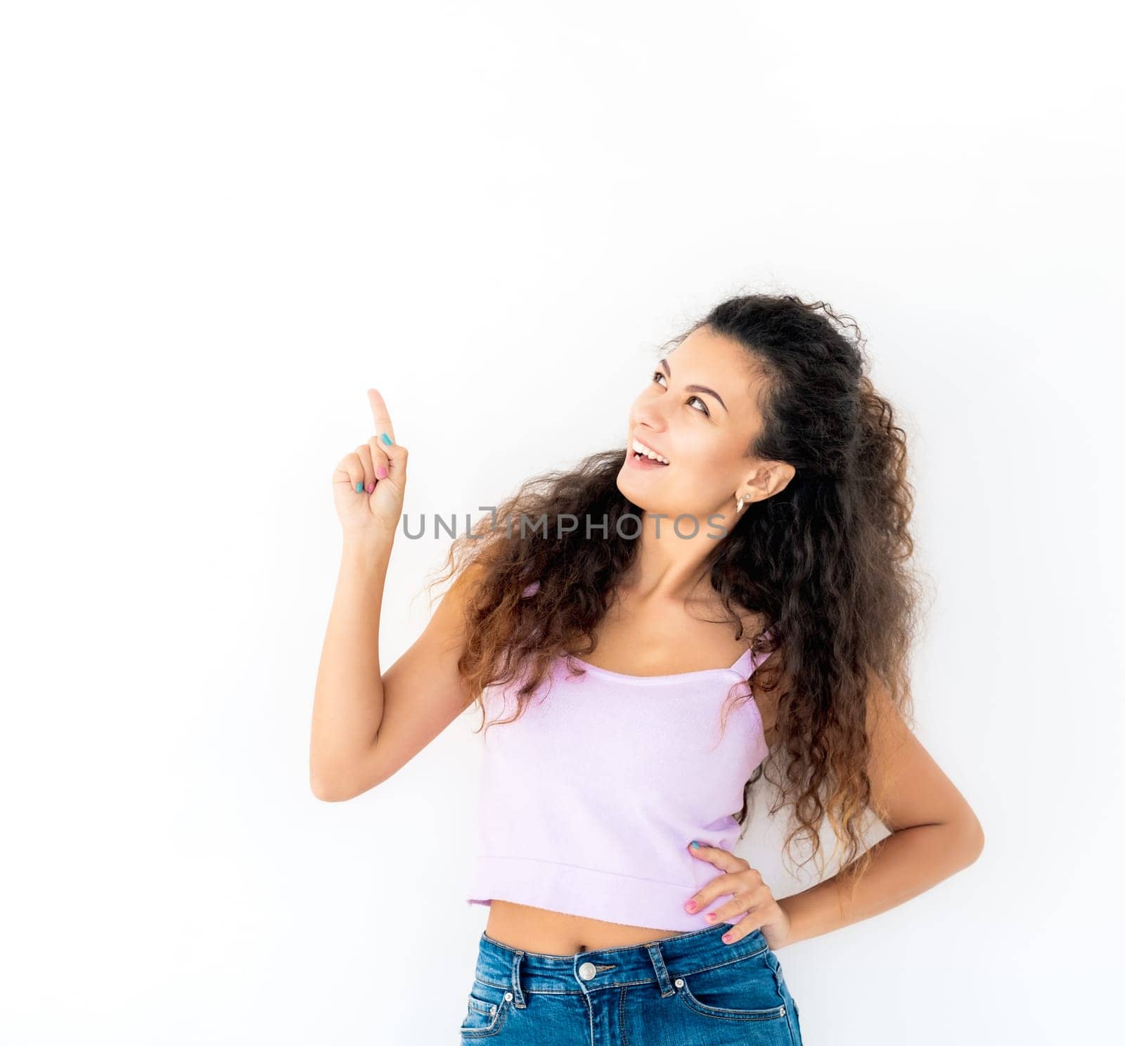 Cute girl looking above and pointing something