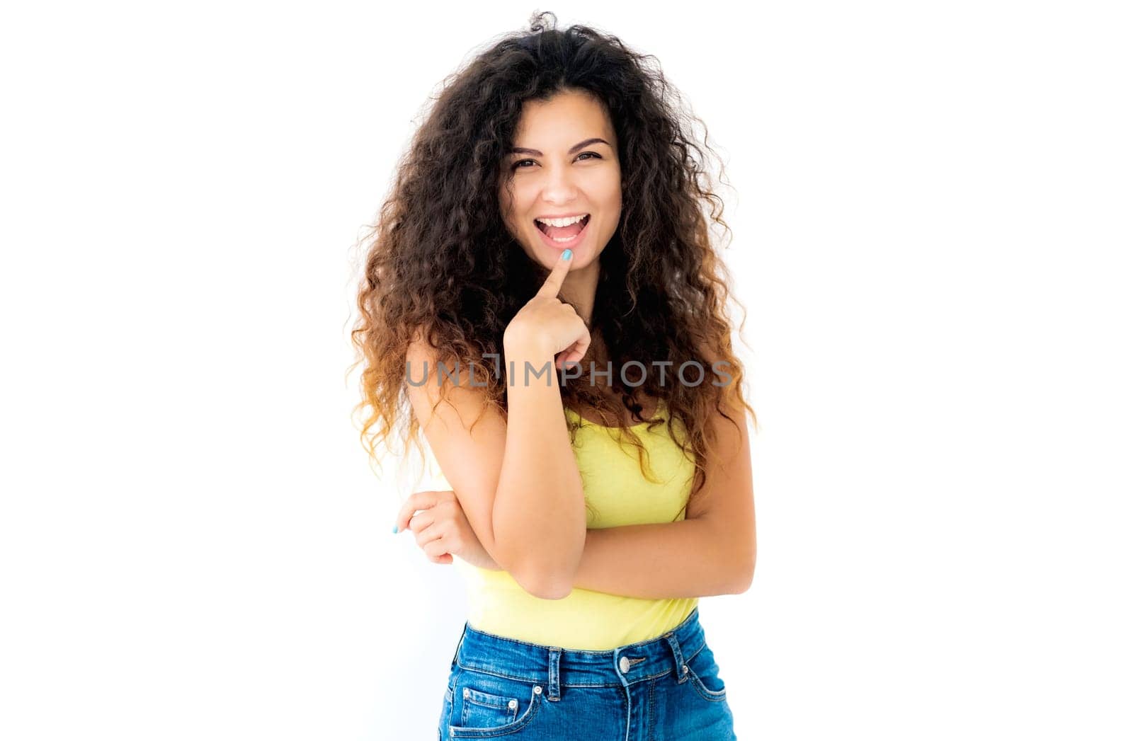 Cheerfully laughing young girl looking in camera