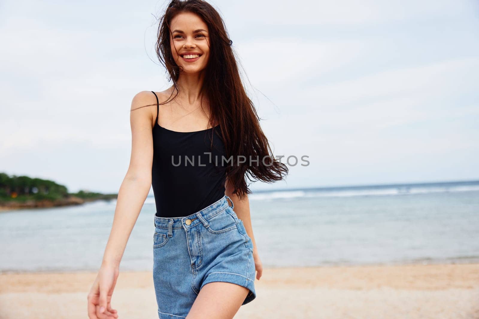 woman active leisure beauty ocean running freedom lifestyle fun tan beach female travel sunset sunrise young summer wave sea hair smile