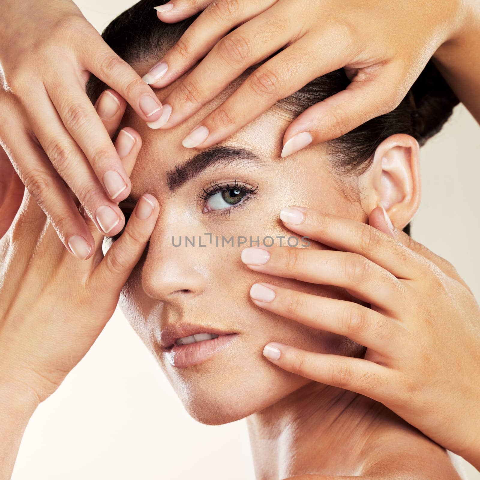 Skincare, beauty and hands on face of woman portrait in studio with natural makeup or cosmetics. Aesthetic model person for facial wellness and dermatology for skin glow, salon or spa manicure.