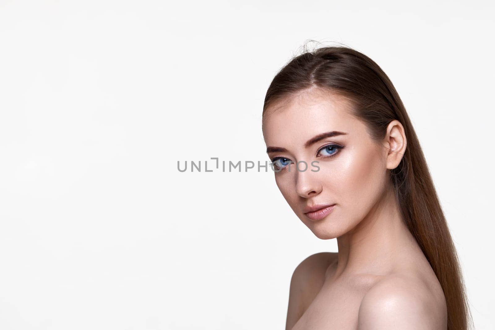 profile of beautiful young woman with perfect skin on white background. copy space