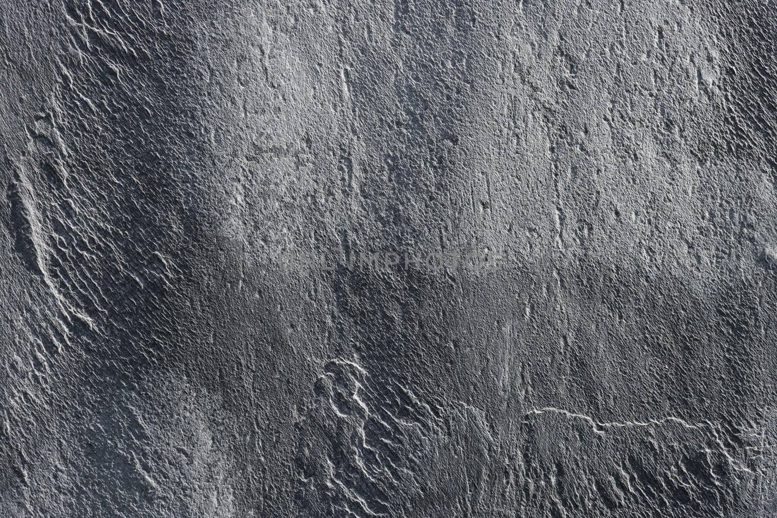 Texture of old gray granite on the wall.