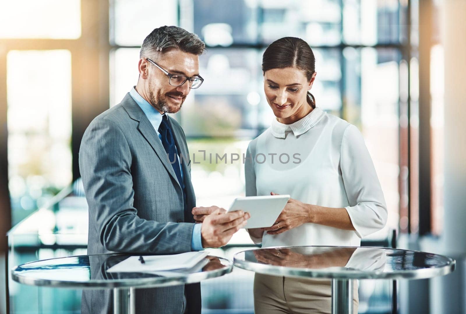 Tablet, coaching and teamwork with business people in office for networking, communication and planning. Idea, collaboration and corporate with employees for partnership, review and meeting.