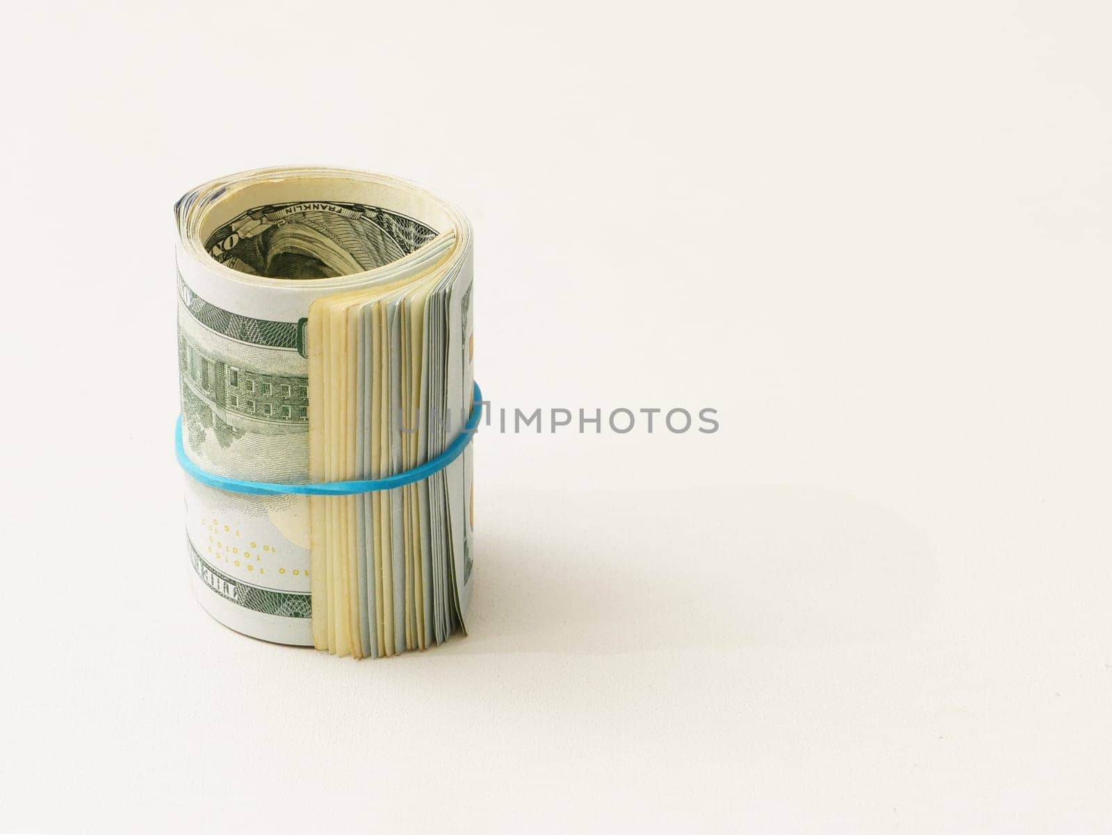 Rolled up dollar bills on a white background. by gelog67