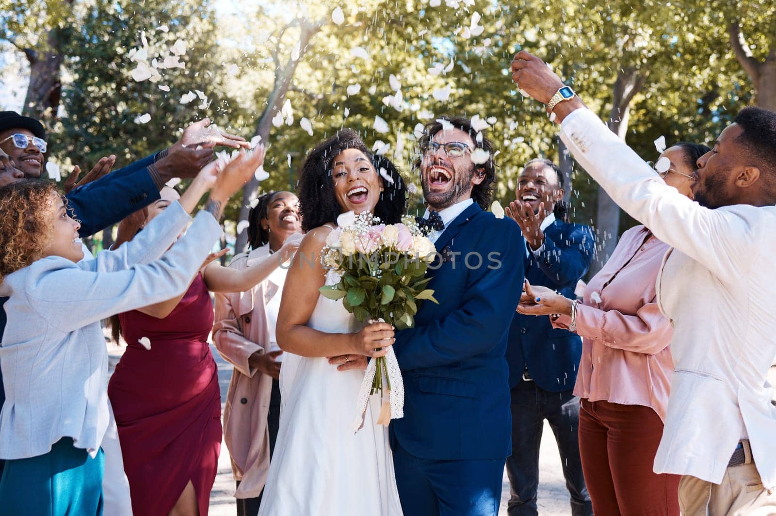 Wedding confetti, marriage couple and celebration of audience throwing flower petals outdoor. Happiness, excited and social event with bride and man laughing from love and congratulations applause.