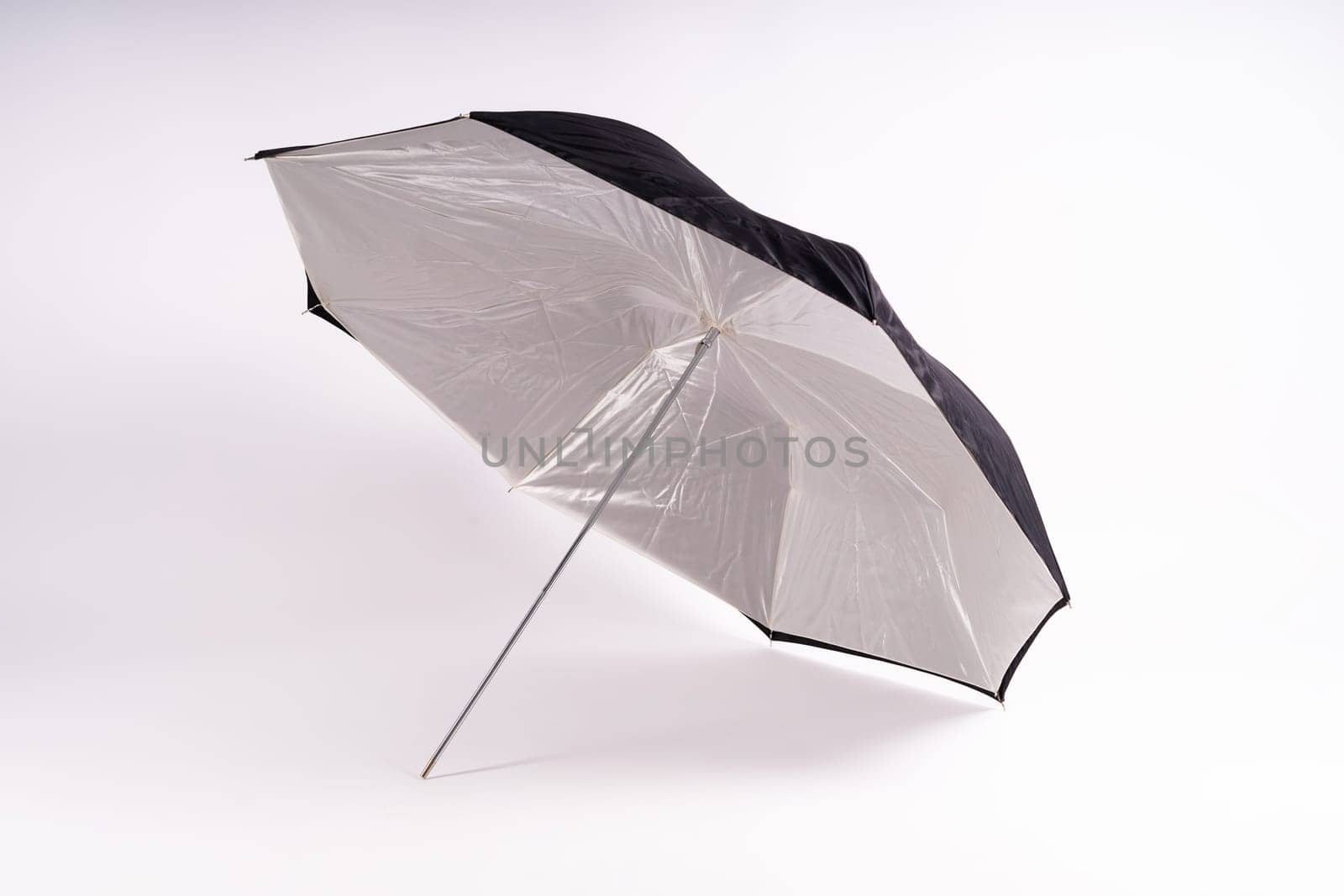 Photography studio light reflector isolated on white background umbrella