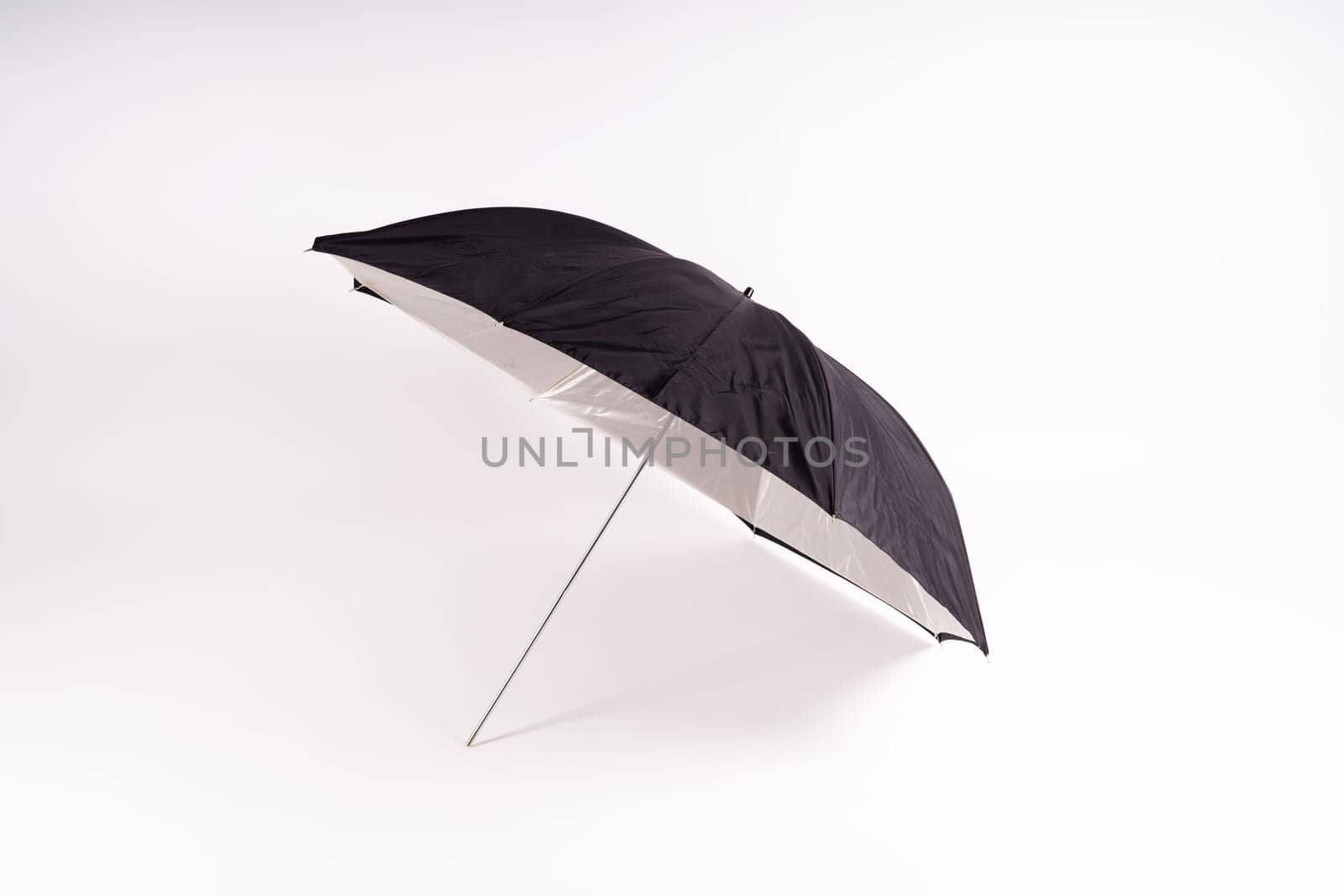 Photography studio light reflector - isolated on white background umbrella. by Zelenin