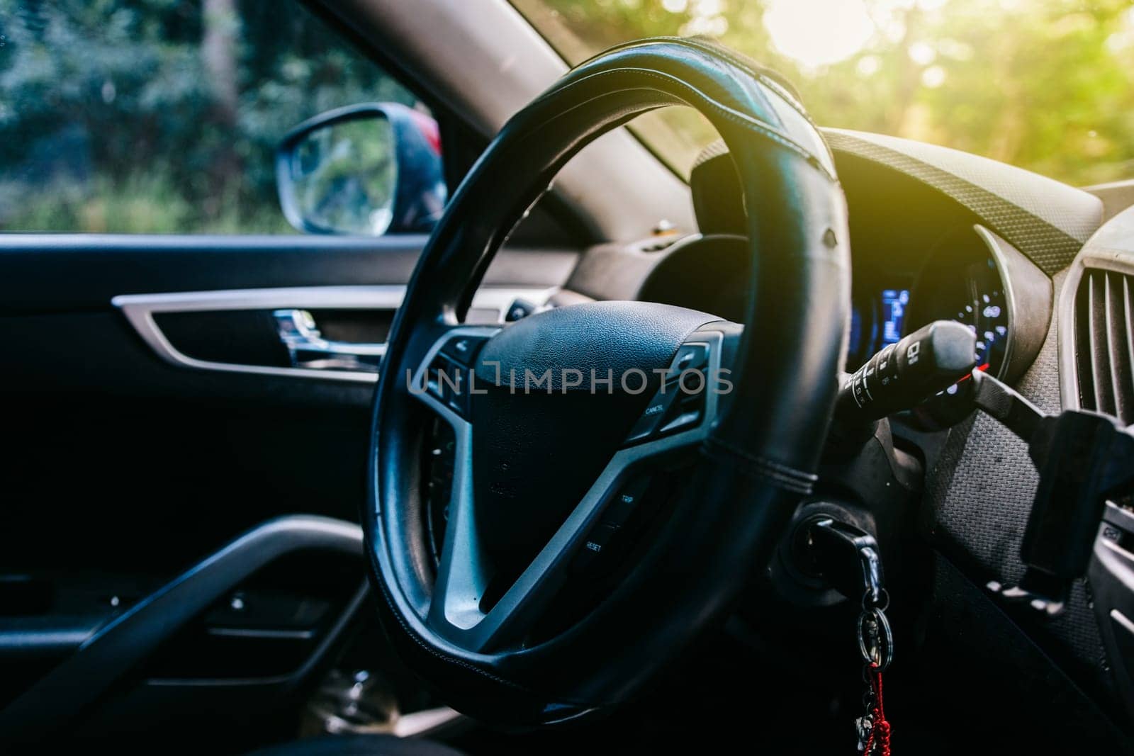 Close-up of the steering wheel of a modern car. View of the steering wheel of a modern car by isaiphoto