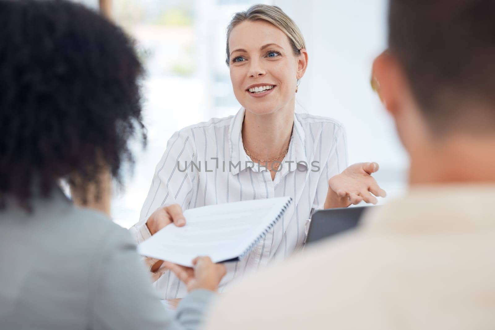 Report, meeting and business people in communication about a contract, deal or feedback on a company budget. Corporate, talking and worker with a paper document with information on marketing at work by YuriArcurs