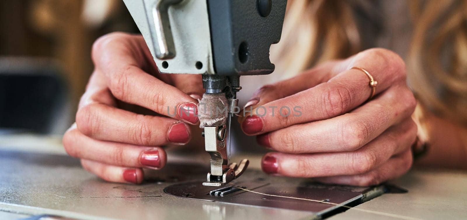 Life is better when you sew. a young fashion designer using a sewing machine in her workshop