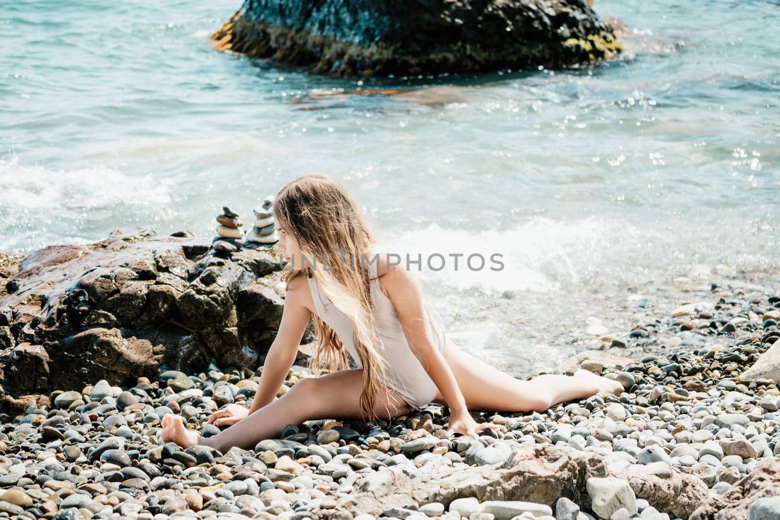 Silhouette mother and daughter doing yoga at beach. Woman on yoga mat in beach meditation, mental health training or mind wellness by ocean, sea