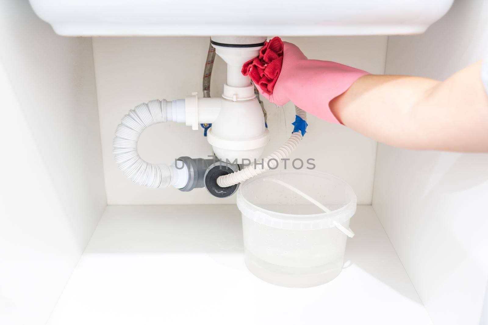 Leakage Of Water From plastic Pipe under sink in laundry room by Mariakray
