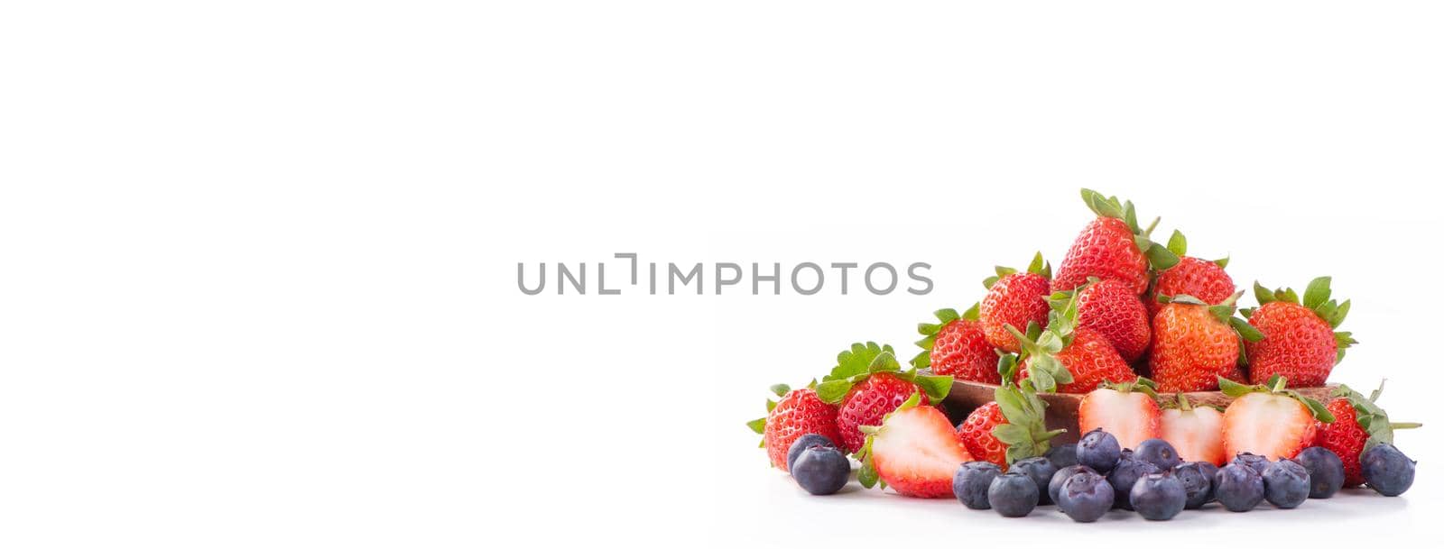 A bowl set of beautiful and delicious strawberry and blueberry isolated on white background, close up, copy space, clipping path, cut out. by ROMIXIMAGE