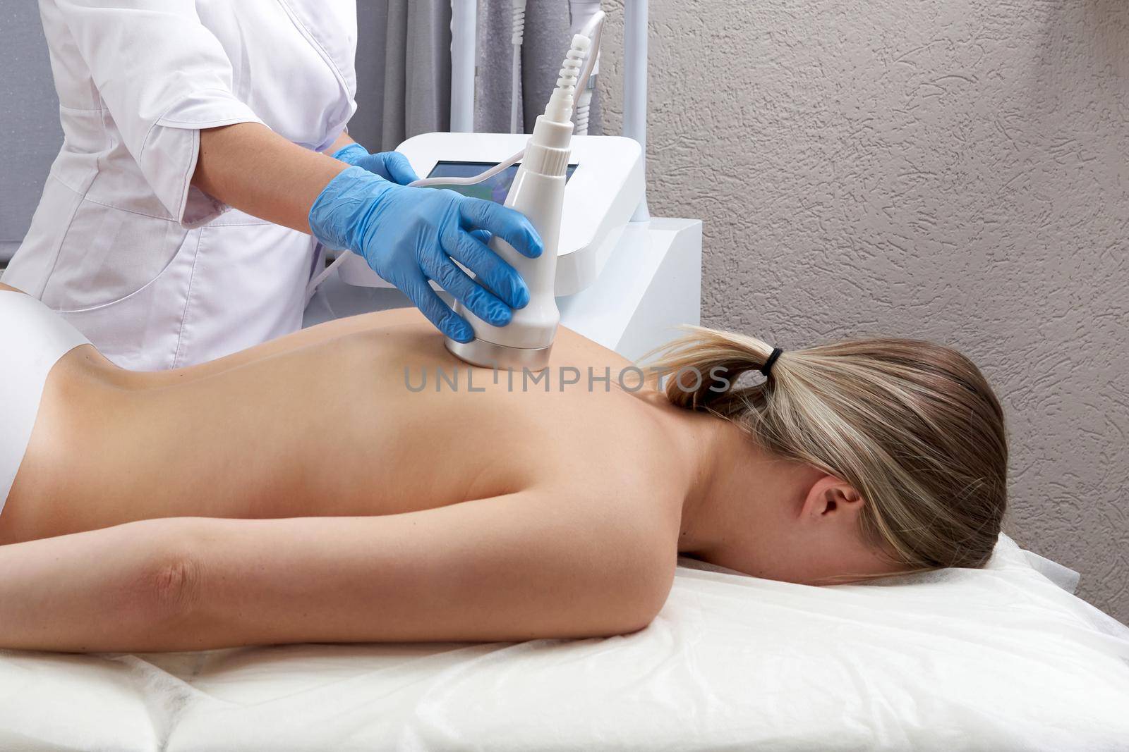 Hardware cosmetology. Young woman getting beauty treatment in a spa salon